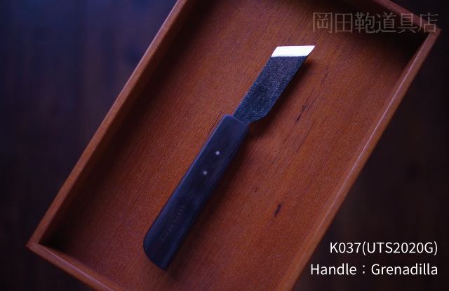 K037